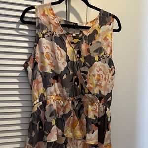 Peplum-style, sleeveless dress shirt. Size medium from LOFT.
